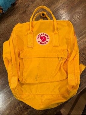Fjallraven Kanken Backpack in Bright Yellow with Red Logo